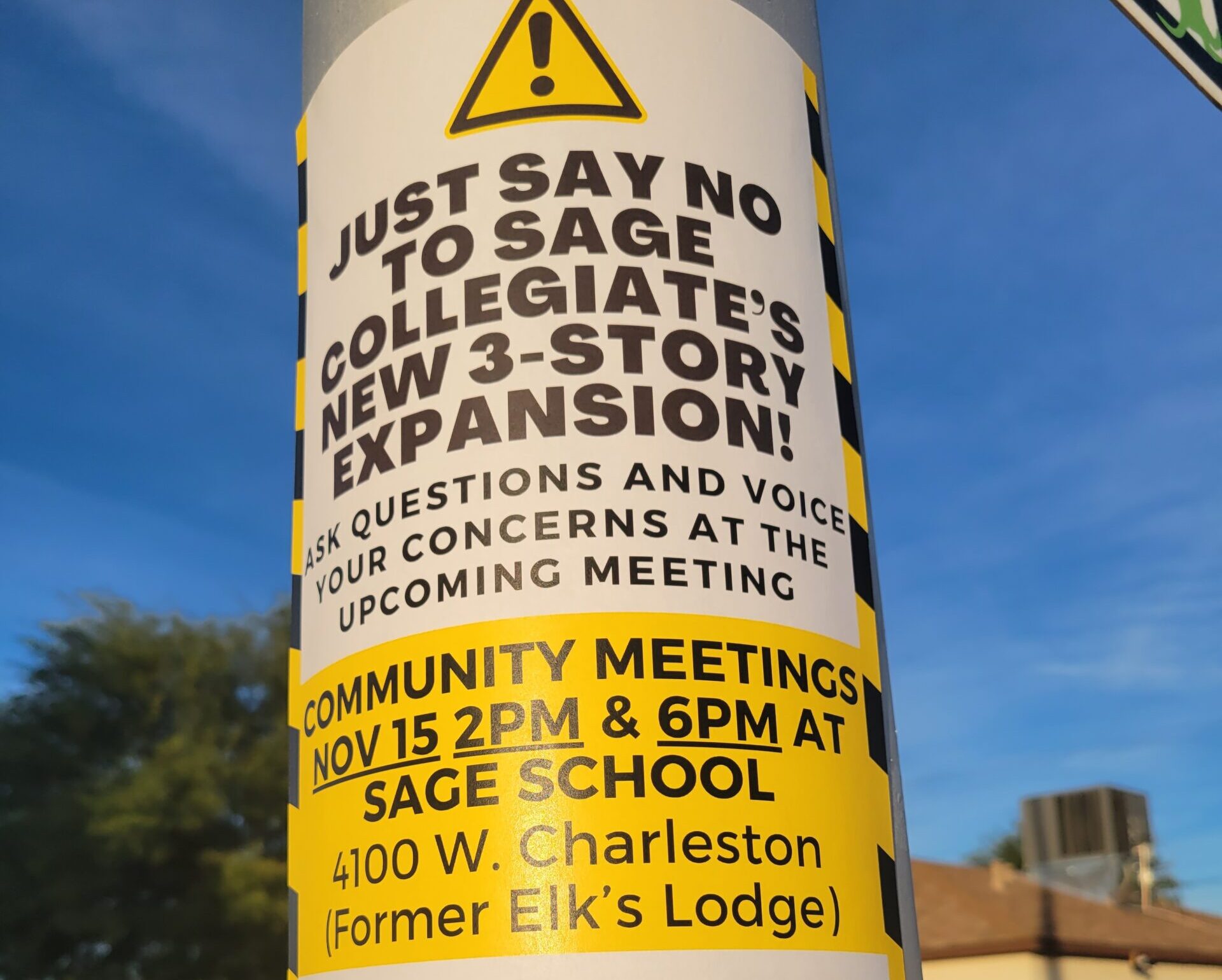 Sign on a post inviting people to come to Sage Collegiate to express concerns with the school's expansion