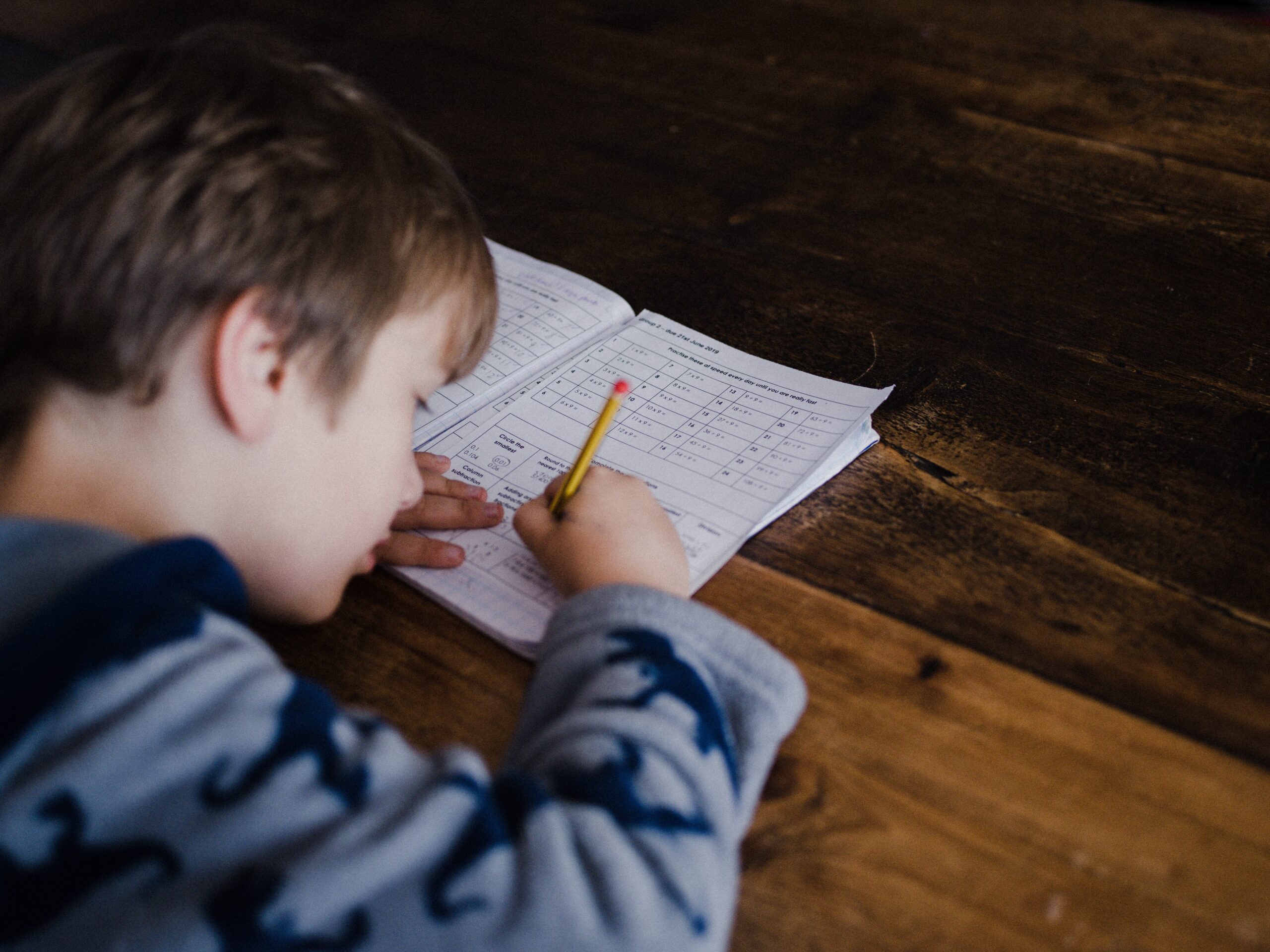 little boy doing homework