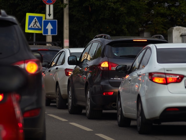 cars backed up, bumper to bumper indicating traffic caused by sage collegiate